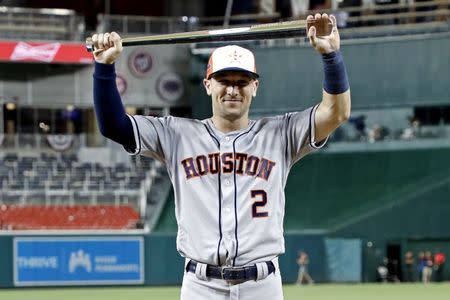 Jul 17, 2018; Washington, DC, USA; American League infielder Alex Bregman (2) of the Houston Astros (2) poses with the MVP trophy after the 2018 MLB All Star Game at Nationals Ballpark. Mandatory Credit: Geoff Burke-USA TODAY Sports