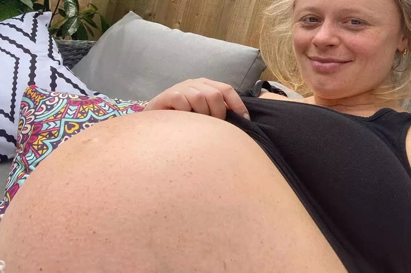 Emily Atack shows huge bump