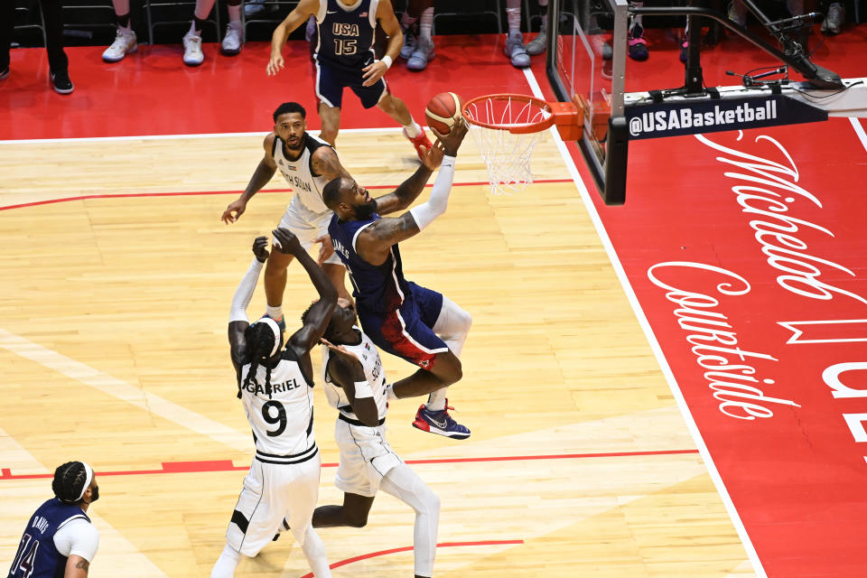 LeBron slices through the defense for the game-winning layup. (Mansoor Ahmed/NBAE via Getty Images)