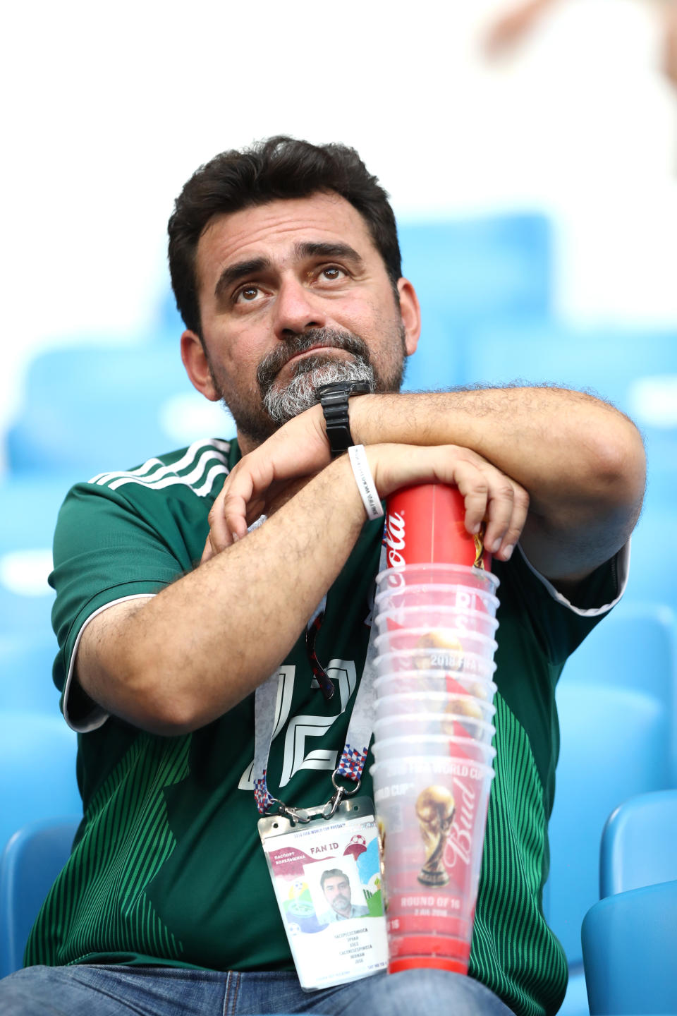 <p>A Mexico fan looks dejected following his sides defeat in the 2018 FIFA World Cup Russia Round of 16 match between Brazil and Mexico at Samara Arena on July 2, 2018 in Samara, Russia. (Photo by Ryan Pierse/Getty Images) </p>