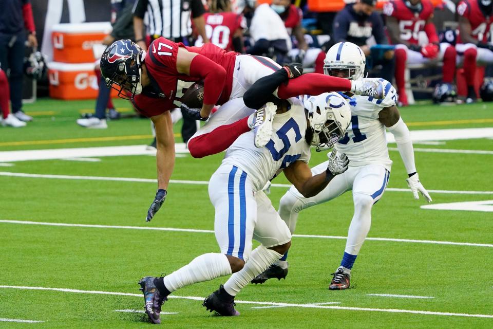 Texans receiver Chad Hansen is hit by Colts linebacker Anthony Walker after a catch Dec. 6, 2020, in Houston.