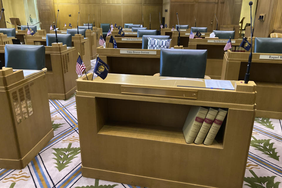 The desk of former Oregon state Rep. Mike Nearman, who was ousted by the House in a historic vote Thursday night, is seen with the nameplate removed Friday, June 11, 2021, at the Oregon State Capitol in Salem, Oregon. Republican lawmakers voted with majority Democrats to take the historic step of expelling the Republican member who let violent, far-right protesters into the state Capitol on Dec. 21. (AP Photo/Andrew Selsky)