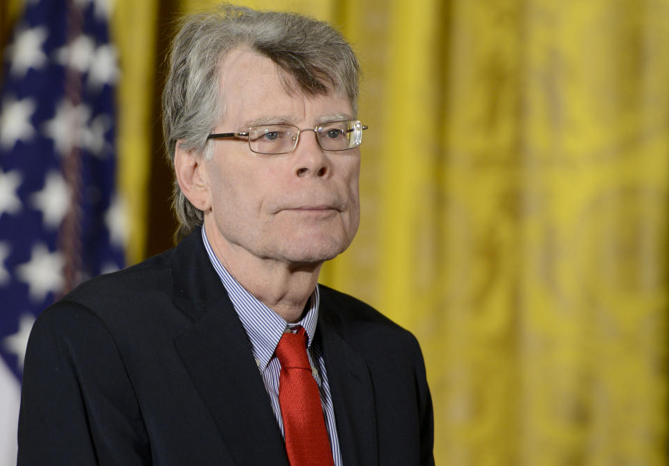 WASHINGTON, DC - SEPTEMBER 10:  President Barack Obama presents author Stephen King with the 2014 National Medal of Arts at The White House on September 10, 2015 in Washington, DC.  (Photo by Leigh Vogel/WireImage)