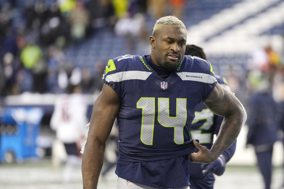 Seattle Seahawks' DK Metcalf walks off the field after the team lost to the Chicago Bears in an NFL football game, Sunday, Dec. 26, 2021, in Seattle. (AP Photo/Stephen Brashear)