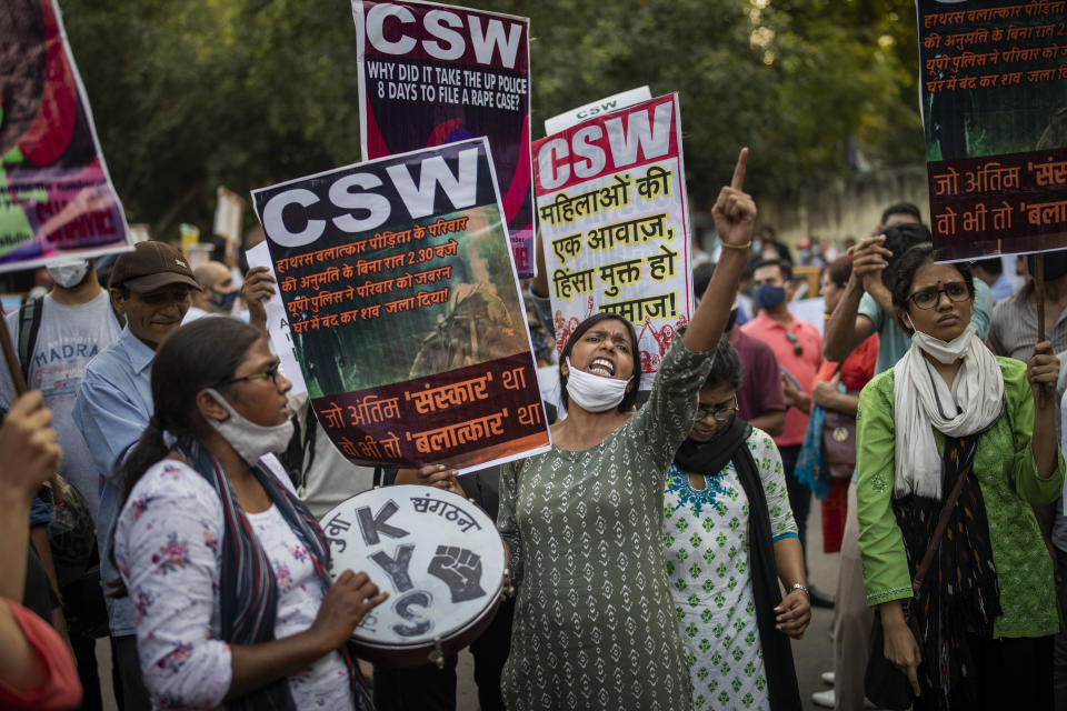 An activist shouts slogans during a protest against the gang rape and killing of a woman in India's northern state of Uttar Pradesh, in New Delhi, India, Friday, Oct. 2, 2020. Hundreds of protesters on Friday demanded the dismissal of a Hindu nationalist government in a northern Indian state where a 19-year-old woman from India’s lowest caste was allegedly gang raped and brutally attacked last month and later died in a hospital. The woman was cremated early Wednesday, with the family alleging that police did not allow them to perform her final rites. (AP Photo/Altaf Qadri)