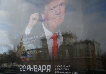 An image of U.S. President-elect Donald Trump is seen on the advertising board of the store "Army of Russia", located opposite the U.S. embassy, in Moscow, Russia, January 20, 2017. REUTERS/Sergei Karpukhin