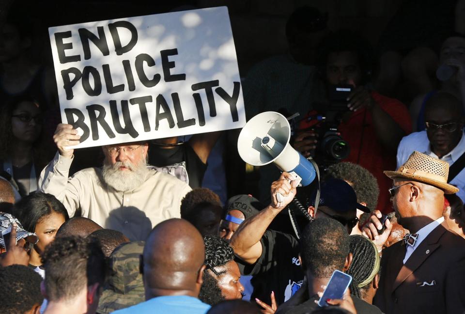 Demonstrators gather near a community pool during a protest earlier this week in response to an incident involving a McKinney police officer. (AP Photo/Ron Jenkins)