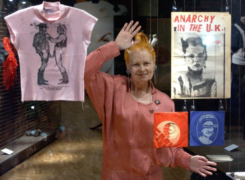 Vivienne Westwood poses with some of her designs at the V&A’s major Westwood exhibition at the London museum. (Credit: Ian West – PA Images/PA Images via Getty Images)