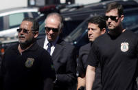 Brazilian Olympic Committee (COB) President Carlos Arthur Nuzman (2nd L) arrives to Federal Police headquarters in Rio de Janeiro, Brazil, September 5, 2017. REUTERS/Ricardo Moraes