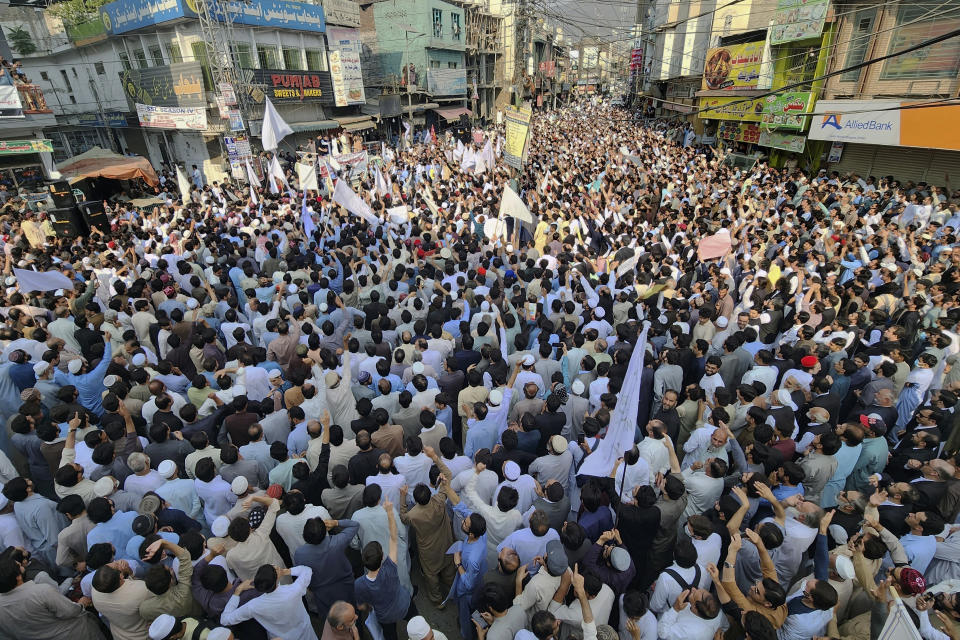 People take part in a protest rally to condemn the killing of a school van driver by a gunman in a Monday attack and demanding the immediate arrest of the attacker, in Mingora, Swat Valley, Pakistan, Tuesday, Oct. 11, 2022. Thousands of people protested in northwest Pakistan on Tuesday after the attack killed the driver and critically injured a child, a decade after schoolgirl Malala Yousufzai was shot by the Taliban in the same city. (AP Photo/Sherin Zada)