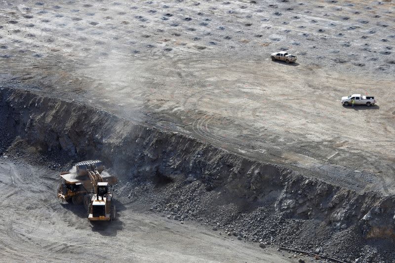 FILE PHOTO: A wheel loader operator fills a truck with ore at the MP Materials rare earth mine in Mountain Pass