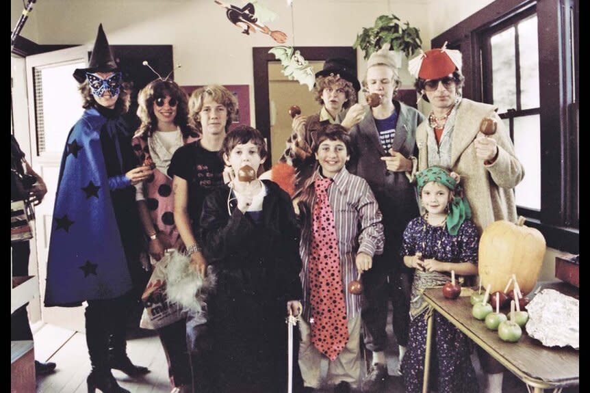 Steven Spielberg (far right) and his young cast celebrate Halloween during the production of E.T. the Extra-Terrestrial (1982)