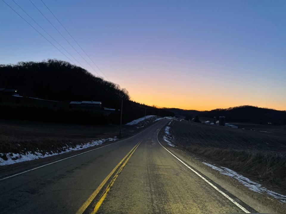 The sun sets on the highways in Sauk County, near where the author and his friend grew up.