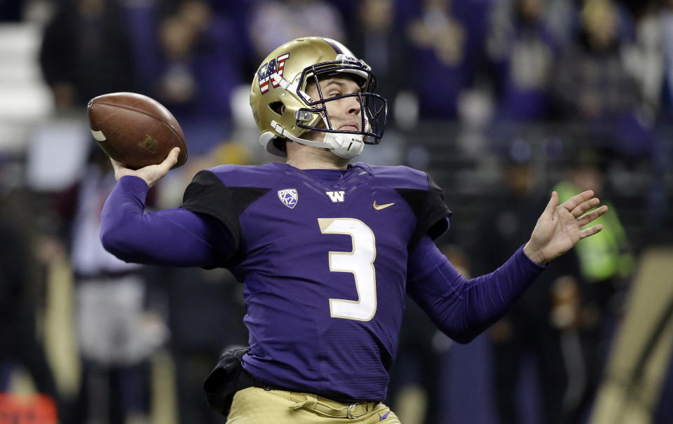 Washington quarterback Jake Browning drops back to pass against Utah during the first half of an NCAA college football game Saturday, Nov. 18, 2017, in Seattle. (AP Photo/Elaine Thompson)