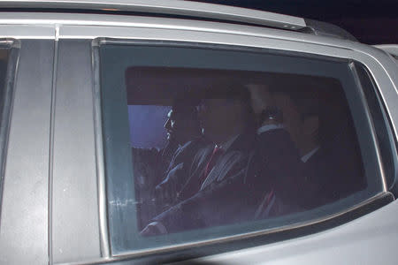 U.S. pastor Andrew Brunson, accompanied by Turkish security officers, arrives at Aliaga Prison and Courthouse complex in a vehicle in Izmir, Turkey October 12, 2018. Taylan Yildirim, Demiroren News Agency, DHA via REUTERS