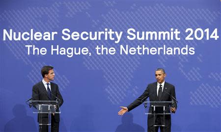 U.S. President Barack Obama and Dutch Prime Minister Mark Rutte (L) speak during the closing nwes conference of the Nuclear Security Summit in The Hague March 25, 2014. REUTERS/Francois Lenoir