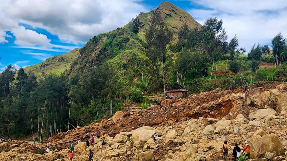 PHOTO: In this image supplied by the International Organization for Migration, villagers search amongst the debris from a landslide in the village of Yambali in the Highlands of Papua New Guinea, May 27, 2024.  (Mohamud Omer/AP)