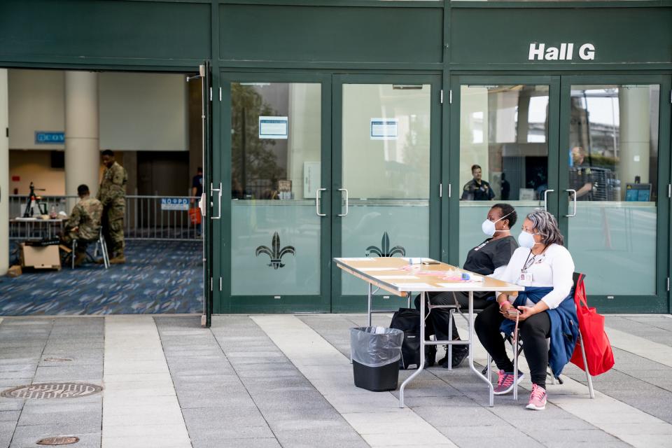 Louisiana Health Department Nursing Staff wait to check IDs and take temperatures of people wishing to enter the New Orleans Ernest N. Morial Convention Center on April 6, 2020. (Photo: Claire Bangser/AFP via Getty Images)