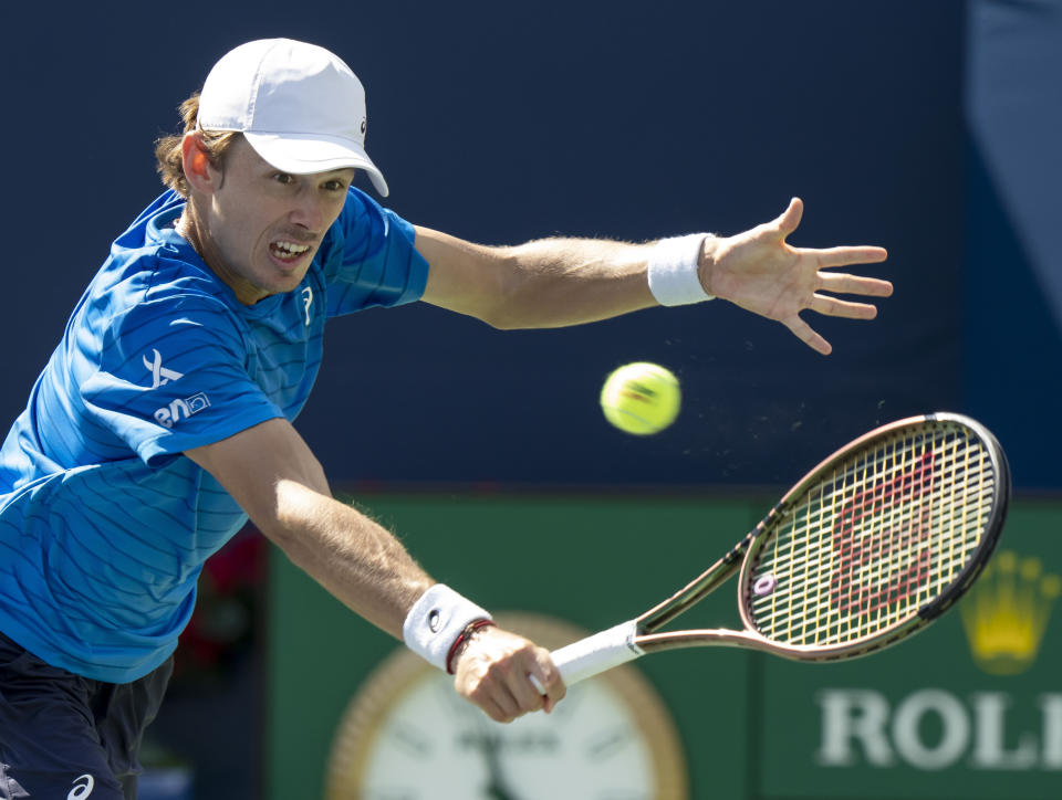 Alex de Minaur of Australia hits a return on his way to defeating Alejandro Davidovich Fokina of Spain during the semifinals of the National Bank Open men’s tennis tournament Saturday, Aug. 12, 2023, in Toronto. (Frank Gunn/The Canadian Press via AP)