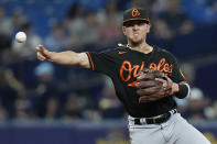 Baltimore Orioles third baseman Ramon Urias commits a throwing error allowing Tampa Bay Rays' Christian Bethancourt to reach first base during the fifth inning of a baseball game Friday, Aug. 12, 2022, in St. Petersburg, Fla. (AP Photo/Chris O'Meara)