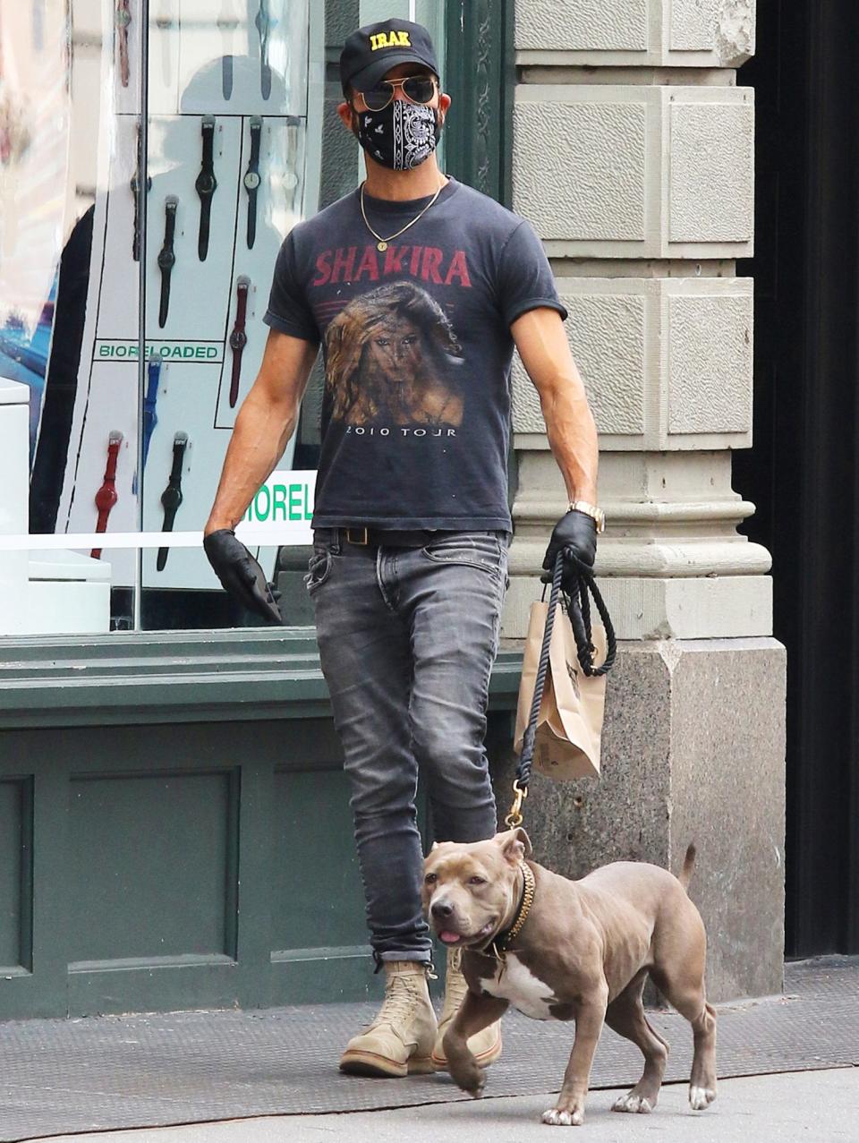 <p>Justin Theroux wears some Shakira merch while walking his dog on Sunday in N.Y.C.</p>