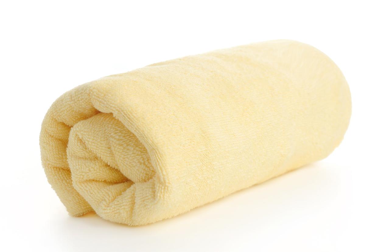 yellow towel rolled up