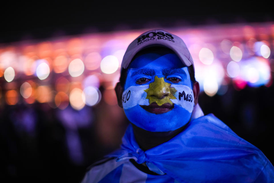 A fan of Argentina team poses for a photograph at the end of the World Cup semifinal soccer match between Argentina and Croatia played at the Lusail Stadium, in Doha, Qatar, Tuesday, Dec. 13, 2022. Argentina won 3-0. (AP Photo/Francisco Seco)