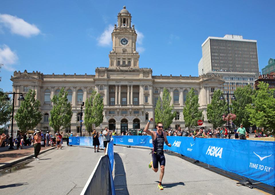 Jason West of USA wins the men's race during the inaugural edition of the Ironman 70.3 mile Des Moines Triathlon. Athletes compete in a 1.2-mile swim at Gray’s Lake, 56.0 mile bike race (shortened due to 3-hour rain delay), and a 13.1 mile run in Des Moines in 2021.