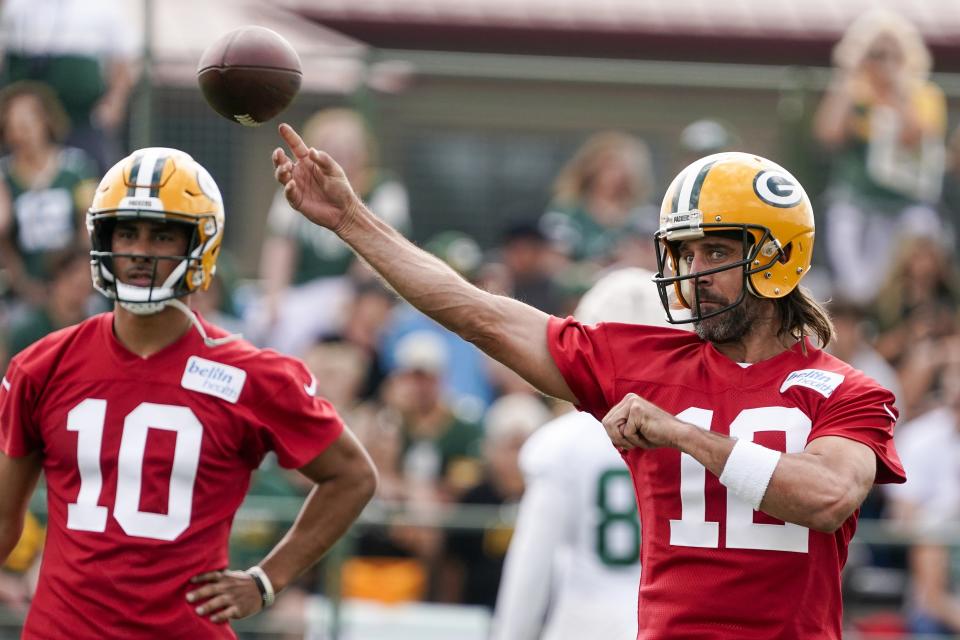 Green Bay Packers' Aaron Rodgers runs a drill at the NFL football team's practice field Wednesday, July 27, 2022, in Green Bay, Wis. (AP Photo/Morry Gash)