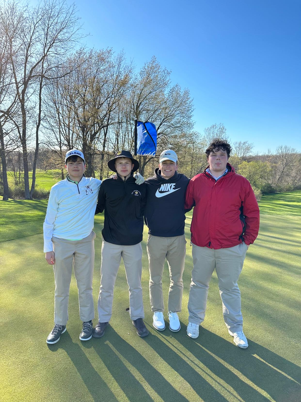 Hillsdale Will Carleton Academy golfers celebrate winning the CAC early season championship. (Pictured): David Maier, Thomas Maier, Will Thielen and Tyler Slade.