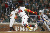 Atlanta Braves' Ronald Acuna Jr. watches his single during the third inning of the team's baseball game against the New York Mets, Saturday, Oct. 1, 2022, in Atlanta. (AP Photo/Brett Davis)