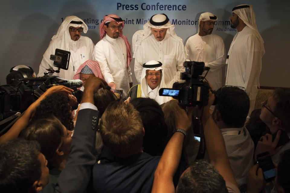 Saudi Energy Minister Prince Abdulaziz bin Salman speaks to journalists after a news conference that followed an OPEC meeting in Abu Dhabi, United Arab Emirates, Thursday, Sept. 12, 2019. OPEC's Joint Ministerial Monitoring Committee met Thursday in Abu Dhabi as estimates of lowered crude oil demand in 2020 have the cartel considering additional production cuts. Before the meeting started, Prince Abdulaziz again called for "cohesiveness" in OPEC. (AP Photo/Jon Gambrell)