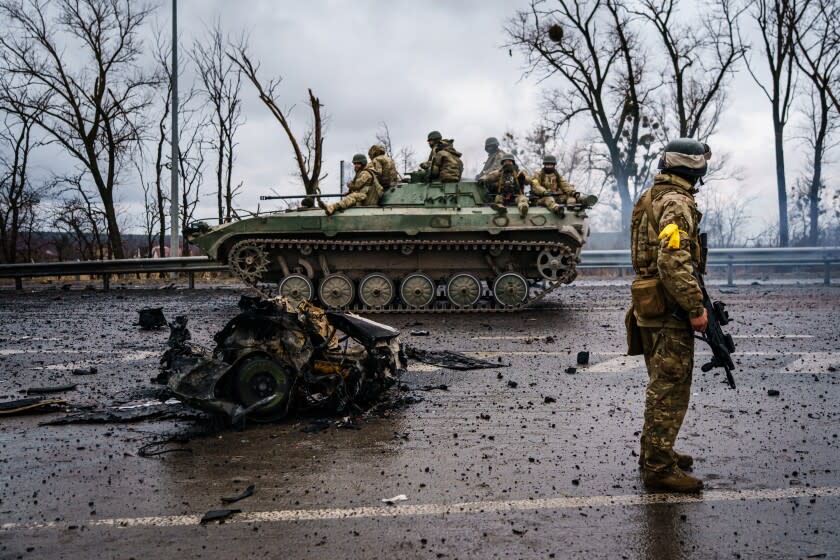 SYTNYAKY, UKRAINE -- MARCH 3, 2022: A Ukrainian military vehicle speeds by on a main road near Sytnyaky, Ukraine, Thursday, March 3, 2022. (MARCUS YAM / LOS ANGELES TIMES)