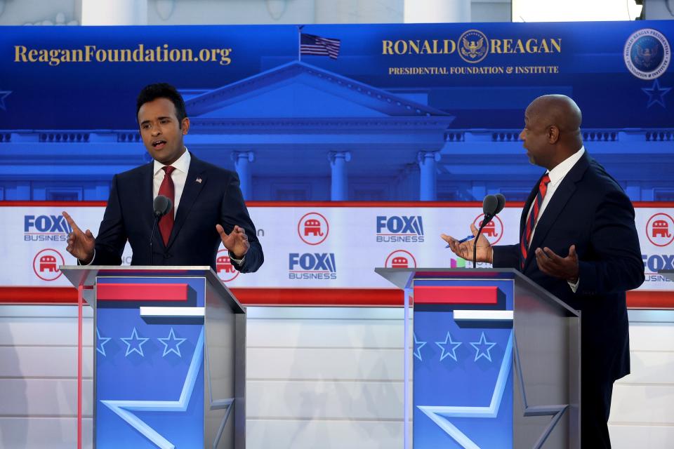 SIMI VALLEY, CALIFORNIA - SEPTEMBER 27: Republican presidential candidates (L-R), Vivek Ramaswamy and U.S. Sen. Tim Scott (R-SC) participate in the FOX Business Republican Primary Debate at the Ronald Reagan Presidential Library on September 27, 2023 in Simi Valley, California. Seven presidential hopefuls squared off in the second Republican primary debate as former U.S. President Donald Trump, currently facing indictments in four locations, declined again to participate. (Photo by Justin Sullivan/Getty Images)