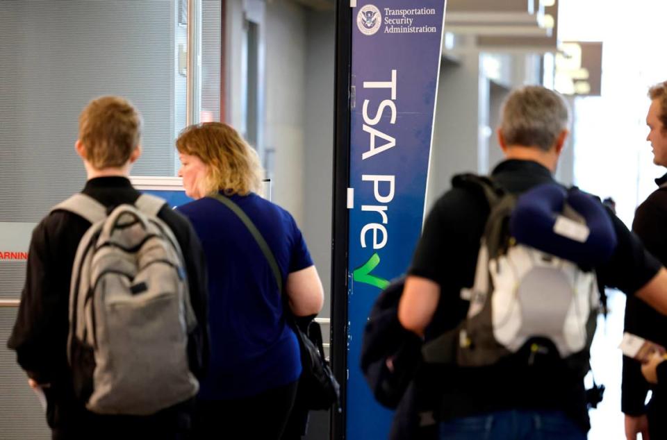 Passengers enter the TSA PreCheck checkpoint at Raleigh-Durham International Airport in Morrisville, N.C., Friday, May 17, 2024.