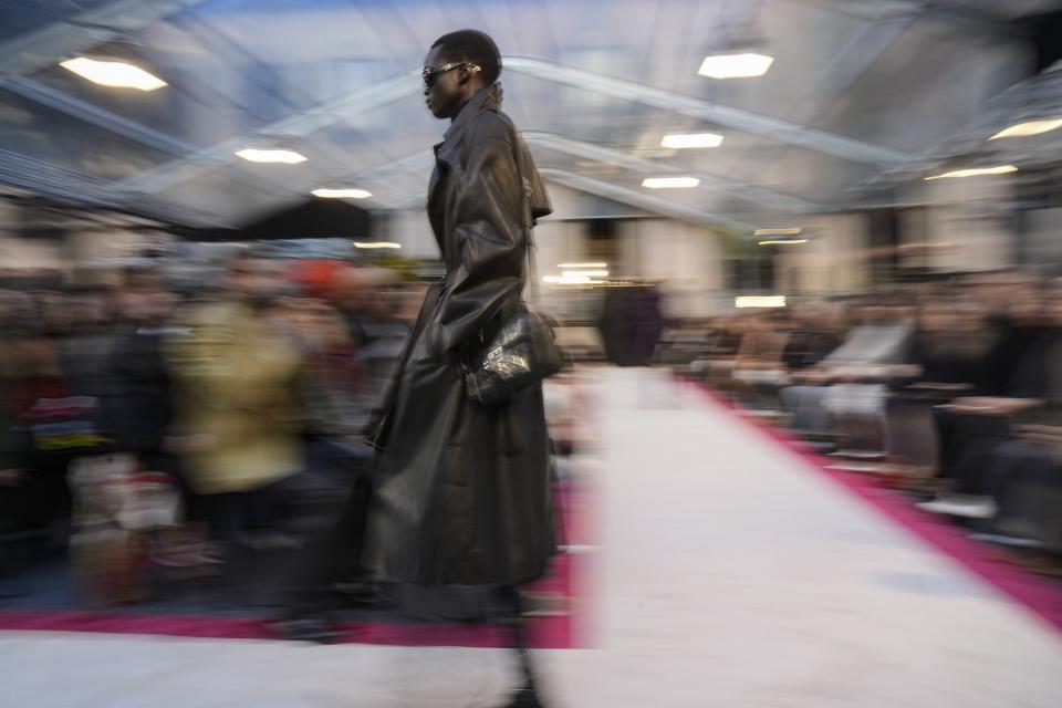 A model wears a creation as part of the Bally women's Fall-Winter 2023-24 collection presented in Milan, Italy, Saturday, Feb. 25, 2023. (AP Photo/Antonio Calanni)