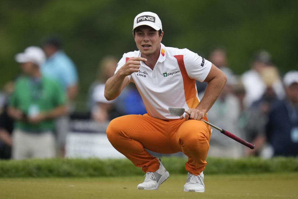 Viktor Hovland, of Norway, lines up a putt on the 15th hole during the second round of the PGA Championship golf tournament at Oak Hill Country Club on Friday, May 19, 2023, in Pittsford, N.Y. (AP Photo/Seth Wenig)