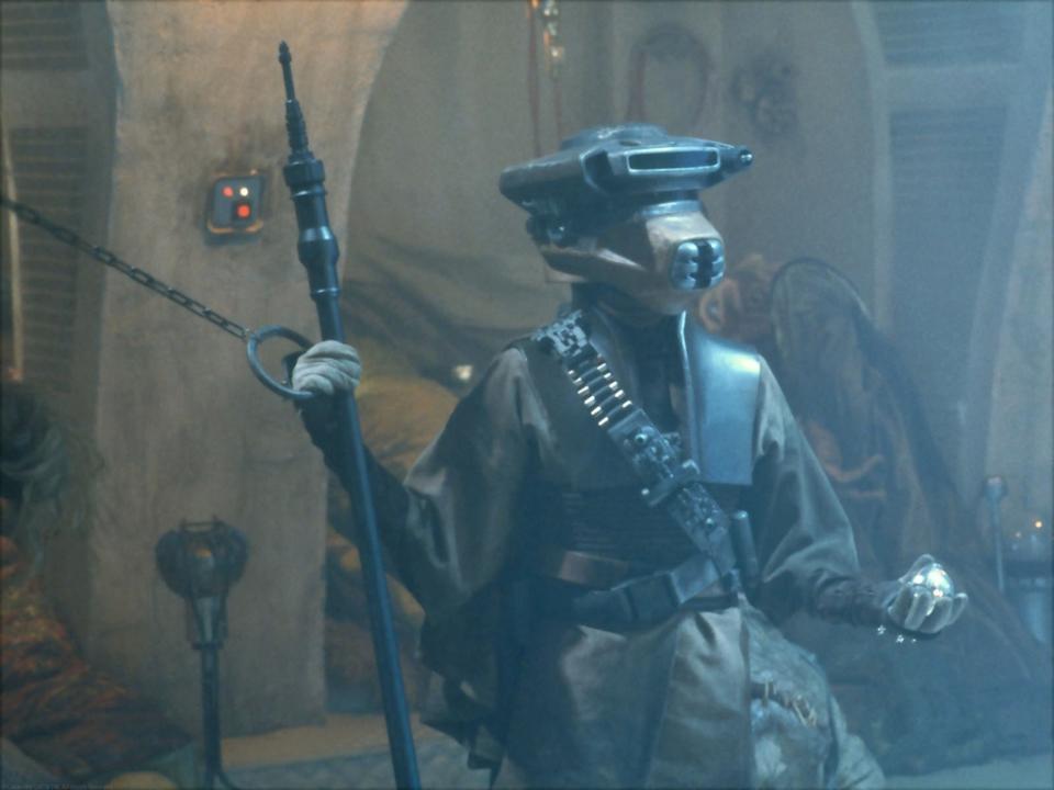 Princess Leia, disguised as bounty hunter Boussh in Star Wars: Episode IV - Return of the Jedi, brandishes a Thermal Detonator. (20th Century Fox/Lucasfilm)