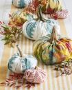 <p>Craft your own personal pumpkin patch using old quilts and fabric scraps. To make, start with a round piece of fabric and a ball of batting (about the size you want your finished pumpkin to be). Gather the fabric up around the batting and hot glue it together in the center. Collect dried stems, or purchase faux stems, and attach with hot glue for a realistic touch.</p>