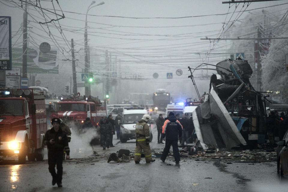 Members of the emergency services work at the site of a bomb blast on a trolleybus in Volgograd December 30, 2013. At least 10 people were killed when an explosion ripped through a trolleybus in the second deadly blast in the Russian city of Volgograd in two days, the Interfax news agency reported, citing law enforcement officials. REUTERS/Sergei Karpov (RUSSIA - Tags: CIVIL UNREST CRIME LAW DISASTER TRANSPORT)