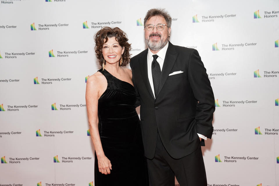 Kennedy Center honoree contemporary Christian and pop singer-songwriter Amy Grant and husband Vince Gill pose on the red carpet at the reception for Kennedy Center honorees ahead of the official gala at the State Department in Washington, D.C., U.S., December 3, 2022. REUTERS/Sarah Silbiger