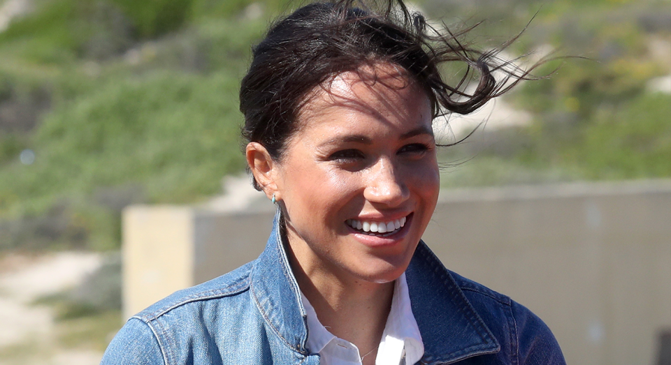 Meghan Markle dressed down in a denim jacket for their second day in South Africa. [Photo: Getty]