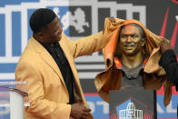 Former NFL player Leroy Butler unveils his bust before speaking during his induction into the Pro Football Hall of Fame, Saturday, Aug. 6, 2022, in Canton, Ohio. (AP Photo/David Richard)