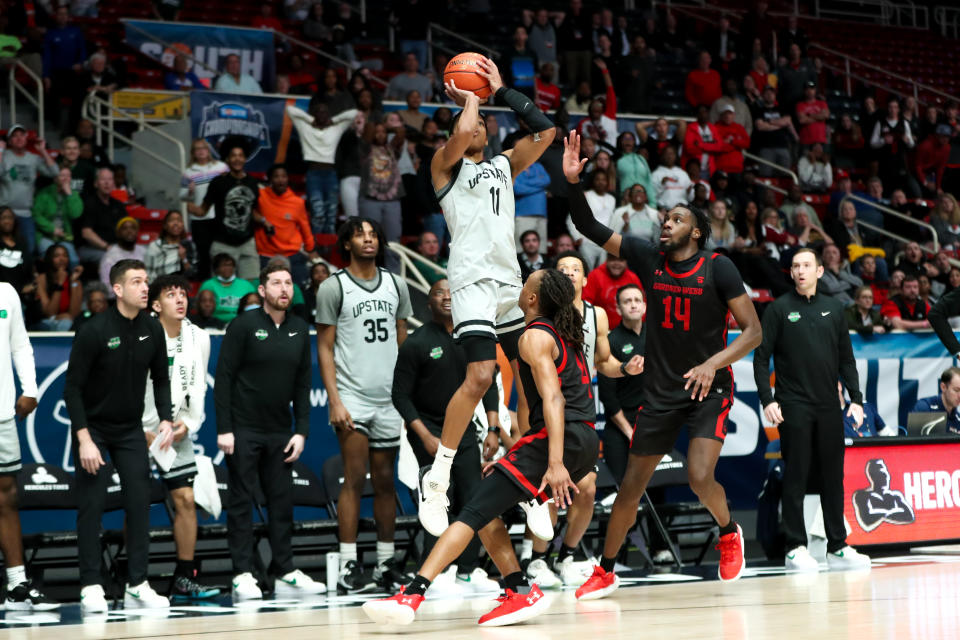 CHARLOTTE, NC - MARCH 03: Jordan Gainey (11) of the USC Upstate Spartans shoots the game winning shot during the Big South Tournament against the Gardner Webb Runnin Bulldogs on March 3, 2023 at Bojangles Coliseum in Charlotte, NC. (Photo by David Jensen/Icon Sportswire via Getty Images)