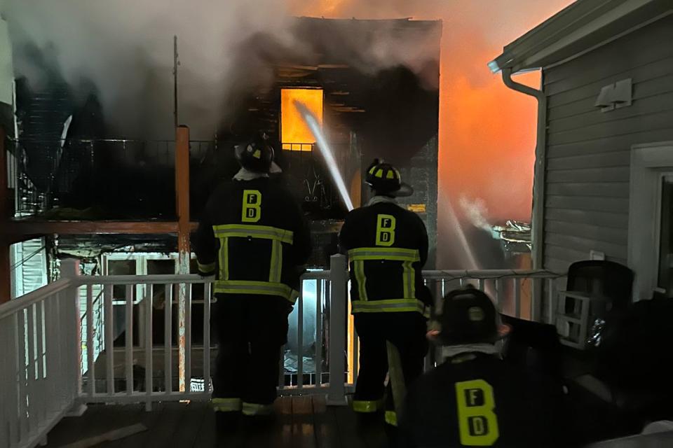 <p>Boston Fire Dept./X</p> Firefighters battle a multi-building blaze in Boston on April 2, 2024