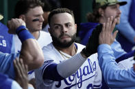 Kansas City Royals' Emmanuel Rivera celebrates in the dugout after hitting a solo home run during the seventh inning of a baseball game against the Minnesota Twins Saturday, May 21, 2022, in Kansas City, Mo. (AP Photo/Charlie Riedel)