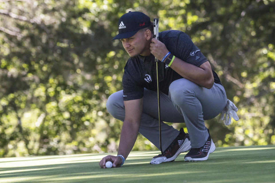 Kansas City Chiefs NFL football quarterback Patrick Mahomes lines up a shot during the first round of the American Century Championship celebrity golf tournament at Edgewood Tahoe Golf Course, Friday, July 14, 2023, in Stateline, Nev. (Hector Amezcua/The Sacramento Bee via AP)