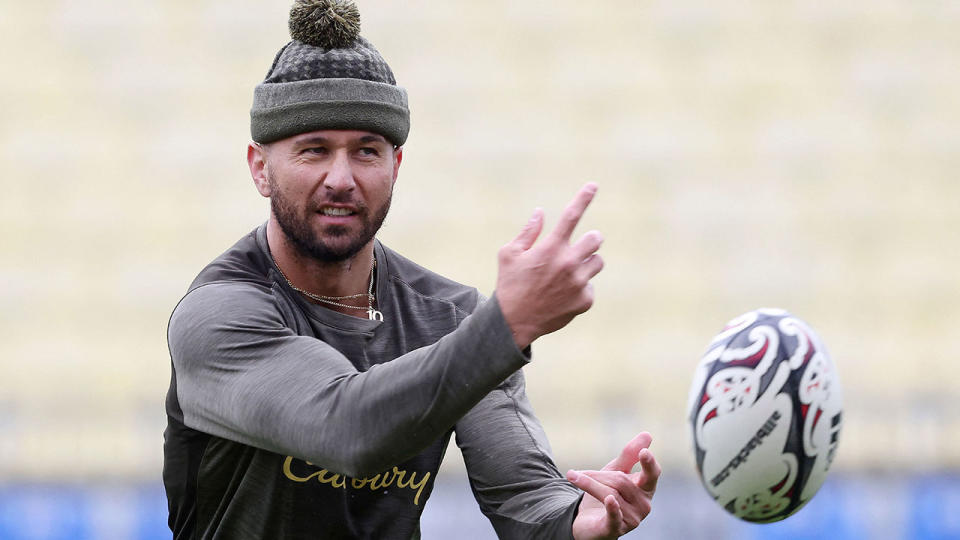 Seen here, Quade Cooper passes the footy at a Wallabies training session.