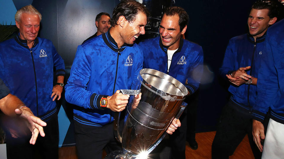 Rafael Nadal and Roger Federer, pictured here celebrating in the locker room.