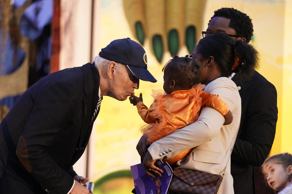 President Joe Biden give treats to trick-or-treaters on the South Lawn of the White House, on Halloween, Monday, Oct. 30, 2023. (AP Photo/Andrew Harnik)